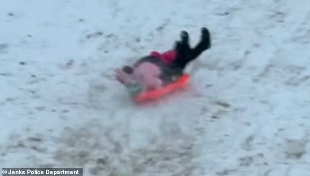 Oklahoma Police Officer Accidentally Collides with Child During Snow Day, Video Goes Viral