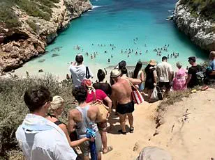 Viral Fame and Mass Tourism Spark Conflict at Caló des Moro: Owners Take Action