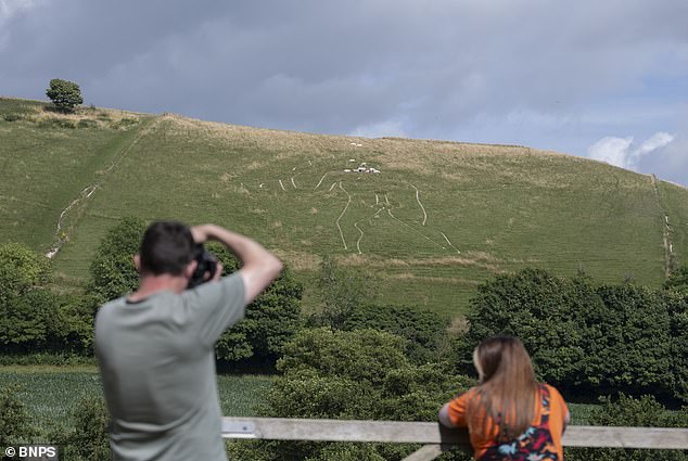 Restoration team uses 17 tonnes of chalk to save eroding giant.