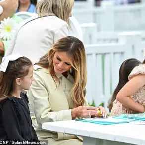 First Lady Melania Trump Dazzles in Cream Trench Coat at Easter Egg Roll
